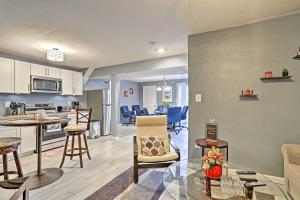 a living room with a kitchen and a dining room at 32 Mi to DC Lower-Level Woodbridge Apt with Patio! in Woodbridge