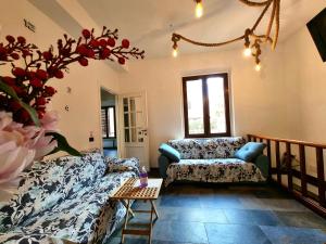 a living room with a couch and a table at Casa indipendente nel cuore di trastevere in Rome