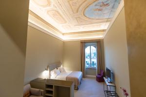 Posteľ alebo postele v izbe v ubytovaní Domus 21 Luxury Suites