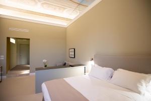 Posteľ alebo postele v izbe v ubytovaní Domus 21 Luxury Suites