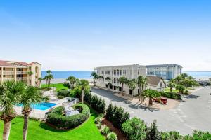 a view of the beach from the balcony of a resort at King & Prince Villa 458 in East End