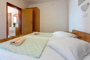 Postel nebo postele na pokoji v ubytování Apartments Anica