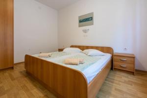 Postel nebo postele na pokoji v ubytování Apartments Anica