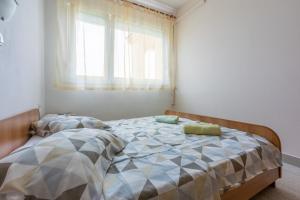 Postel nebo postele na pokoji v ubytování Apartments Anica