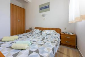 Postel nebo postele na pokoji v ubytování Apartments Anica