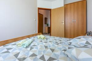 Postel nebo postele na pokoji v ubytování Apartments Anica