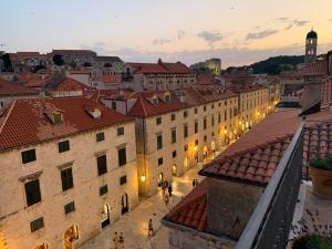 a view of a city at night with buildings at LOCUS Dubrovnik in Dubrovnik