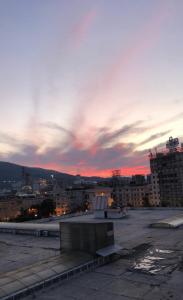 a view of a city skyline with a sunset at MT Apartments Skopje in Skopje