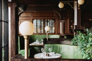 a restaurant with two tables and a window at Rusacks St Andrews in St. Andrews