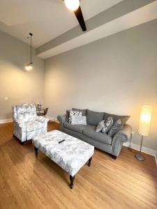 a living room with a couch and a coffee table at Porsch City Loft in Atlanta