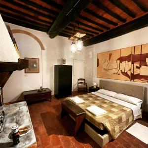 Кровать или кровати в номере Antiche Dimore Vescovado