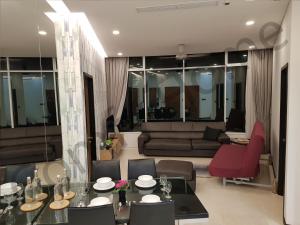 a living room with a couch and a table at KLCC Service suites by Home Sweet Home in Kuala Lumpur