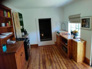 a kitchen with wooden floors and a counter top at Summer1840 in Potchefstroom