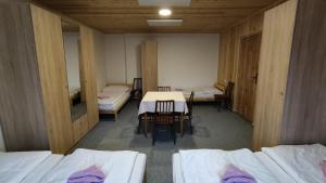 Postel nebo postele na pokoji v ubytování Penzion Na Sluníčku