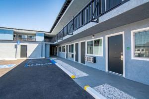 an empty building with a lot of windows at Motel 6 Ridgecrest, CA China Lake in Ridgecrest