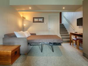 Säng eller sängar i ett rum på Turangi Leisure Lodge