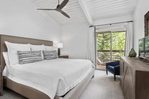 a white bedroom with a bed and a window at Standard 3 Bedroom - Aspen Alps #803 in Aspen