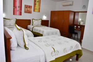Postel nebo postele na pokoji v ubytování Hotel B`Quin Plaza Cúcuta + 37 fotografií