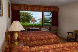 a hotel room with two beds and a window at Hillside Inn in Ellison Bay