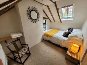 מיטה או מיטות בחדר ב-Auld Cottage