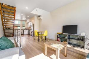 a living room with a couch and a table at Capitol Hill Vista in Seattle