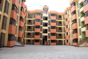 an empty courtyard of an apartment building at Easy Jkia Homestay in Nairobi