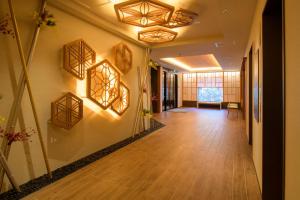 a hallway with wooden panels on the walls of a building at Tosei Hotel Cocone Kamakura in Kamakura