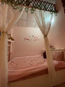 Postel nebo postele na pokoji v ubytování Wangyuku B&B