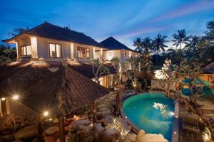 an aerial view of a house with a swimming pool at Mangkun Villa Ubud 1 in Ubud
