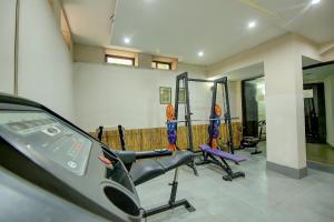 a gym with exercise equipment in a room at FabHotel Phoenix Hospitality in Gurgaon