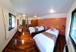 Postel nebo postele na pokoji v ubytování Hotel Siblanburi Resort
