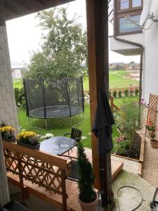 a patio with a table and a basketball hoop at Landhaus ELisabeth in Obereching