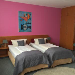 Postel nebo postele na pokoji v ubytování Hotel Servatius