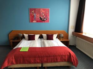 Postel nebo postele na pokoji v ubytování Hotel Servatius