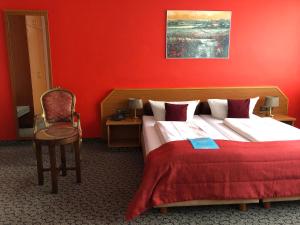 Postel nebo postele na pokoji v ubytování Hotel Servatius