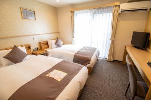 Letto o letti in una camera di Stay SAKURA Kyoto Shijo Karasuma