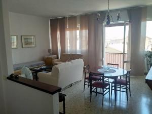 a living room with a couch and a table at "Da Alma" Centro Storico danoifano it in Fano