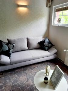 a living room with a couch and a table at Muemling Apartment 1 in Erbach im Odenwald