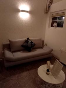 a living room with a couch and a table at Muemling Apartment 1 in Erbach im Odenwald