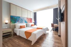 Ліжко або ліжка в номері Bigland Hotel Bogor