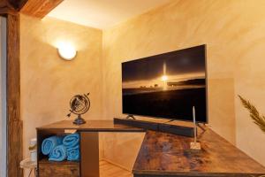 a living room with a large flat screen tv on a wall at Entspannung Pur in Herford