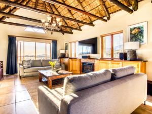 a living room with a couch and a table at Lord's Wine Farm in McGregor