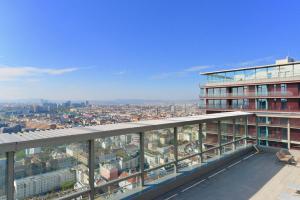 a view of a city from the balcony of a building at Brand-New, Close to Centre, Rooftop-Summer-Pool in Vienna