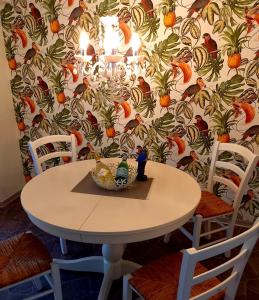 a table and chairs with a bowl on top of it at Muemling Apartment 1 in Erbach im Odenwald