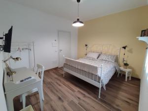 Posteľ alebo postele v izbe v ubytovaní LORA GIUSTA GUEST HOUSE