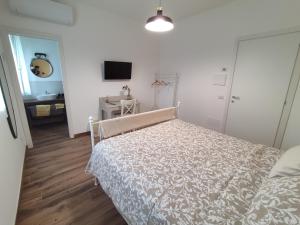 Posteľ alebo postele v izbe v ubytovaní LORA GIUSTA GUEST HOUSE
