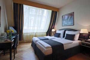 Posteľ alebo postele v izbe v ubytovaní Elysee Hotel