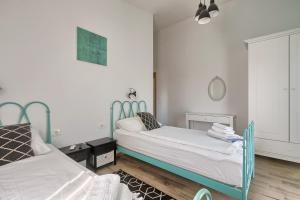 Postel nebo postele na pokoji v ubytování Villa Tea + 37 fotografií