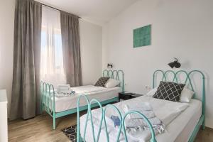 Postel nebo postele na pokoji v ubytování Villa Tea