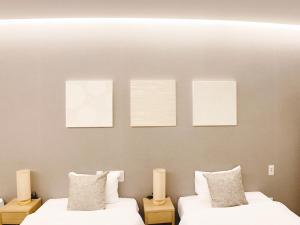 Postel nebo postele na pokoji v ubytování HOTEL CLA-SS HIROSHIMA-TOKAICHI